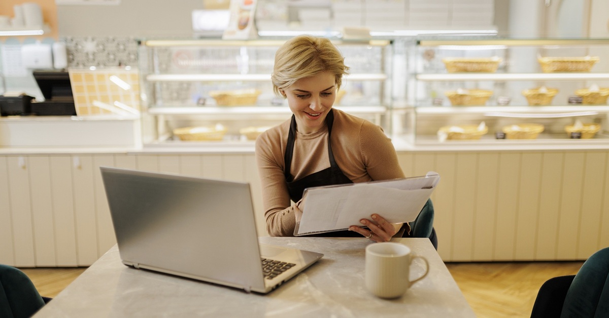 Small business owner reviewing KPI reports